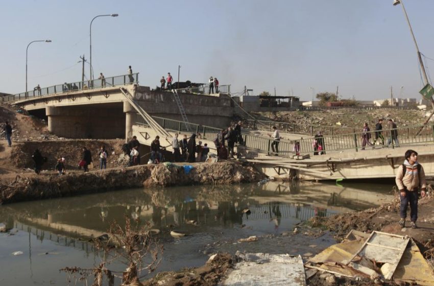  Bombed Mosul bridge still lifeline for long-suffering civilians