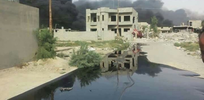  ISIS set ablaze to dozens of oil wells in Qayyarah