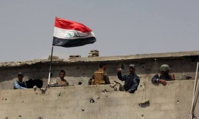  Security forces raise Iraqi flag over Nazim al-Maftoul west of Saqlawiya