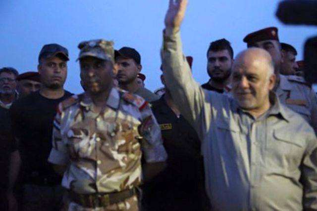  Abadi raises Iraqi flag near Fallujah Hospital