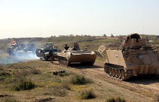  Abrams tanks backed by security forces mass on Tikrit outskirts