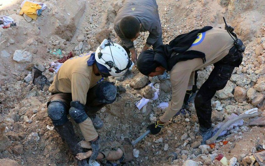  Civil defense transfers remains from mass grave to Idlib Syria