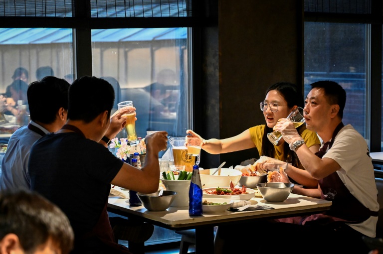  Relief, caution in Beijing as city lifts Covid dine-in curbs