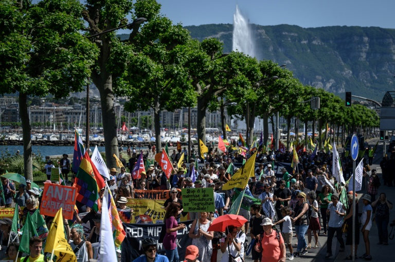  Protesters march in Geneva against WTO role in agriculture