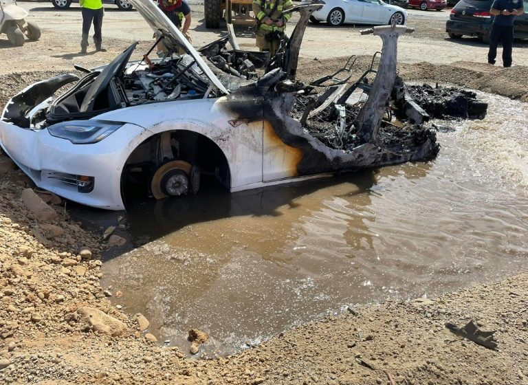  Firefighters struggle stopping flames in a Tesla’s battery compartment  