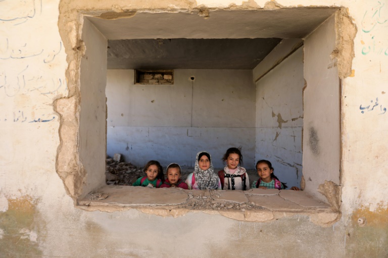  Children return to bombed-out school in Syria frontline town