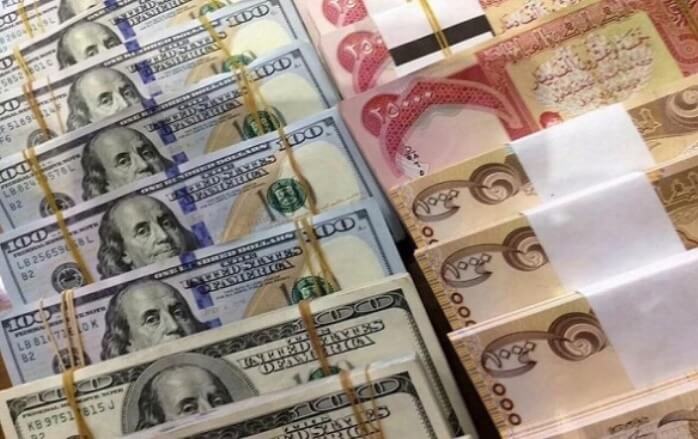 U.S. Federal Reserve imposes tight controls on Iraqi banks’ transactions Packs-of-U.S.-dollars-and-Iraqi-dinars.-Photo-Pukmedia