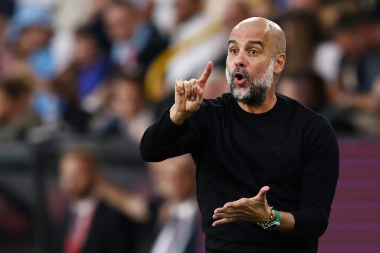  Man City manager Guardiola to miss two matches after back surgery